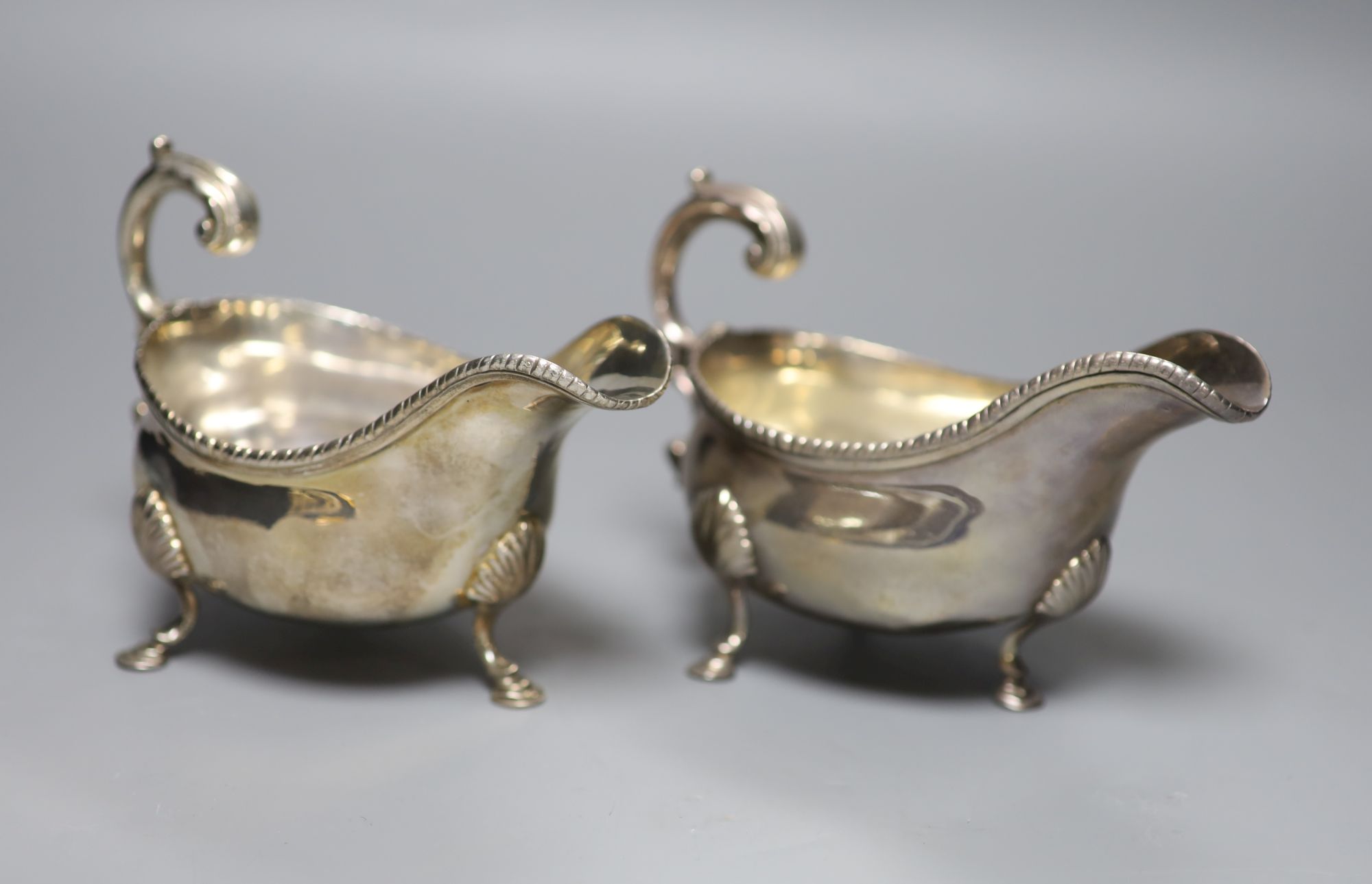 A pair of George III silver sauceboats, London, 1764?, marks rubbed, length 16.5cm, 15.5oz.